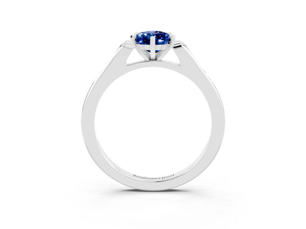 Silver Pear Cut Blue Sapphire Solitaire Ring with Channel Set Round Band and Prong Setting