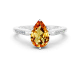 White gold Pear Cut Cut Channel Set Solitaire Engagement Ring with Four-Prong Setting