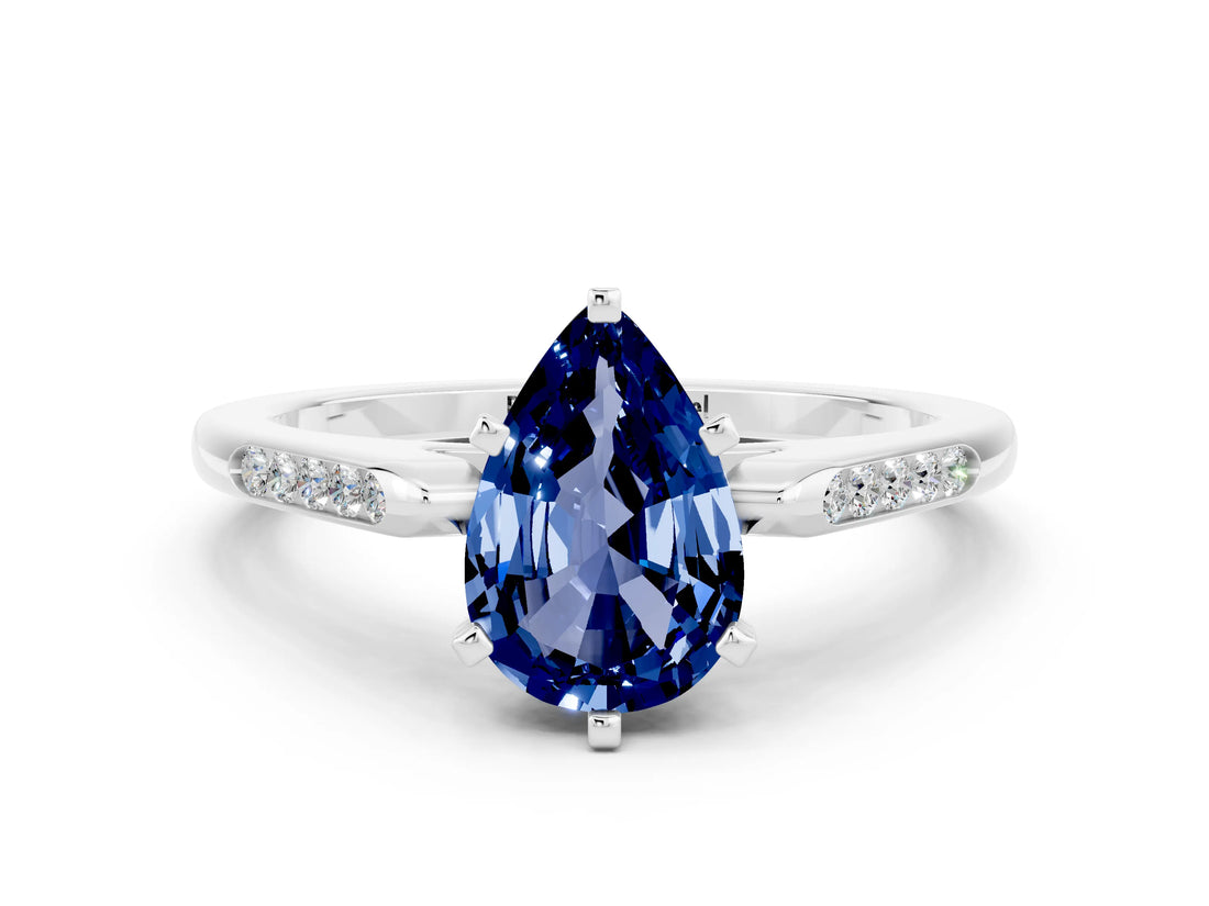White gold Pear Cut Cut Channel Set Solitaire Engagement Ring with Four-Prong Setting