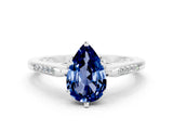 White gold Pear Cut Cut Channel Set Solitaire Engagement Ring with Four-Prong Setting