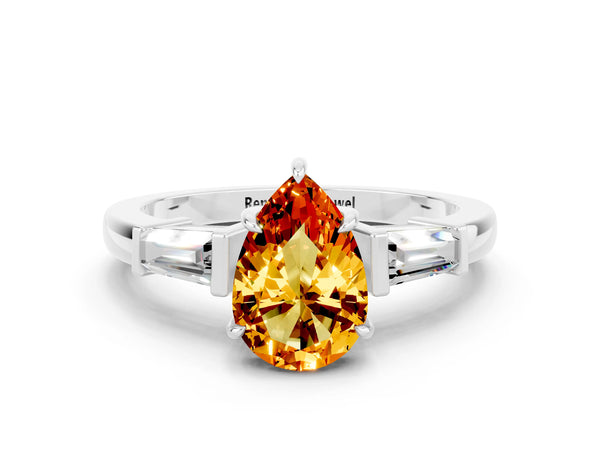Silver Pear Cut Citrine Three-Stone Ring with Tapered Baguette Side Stones and Prong Setting