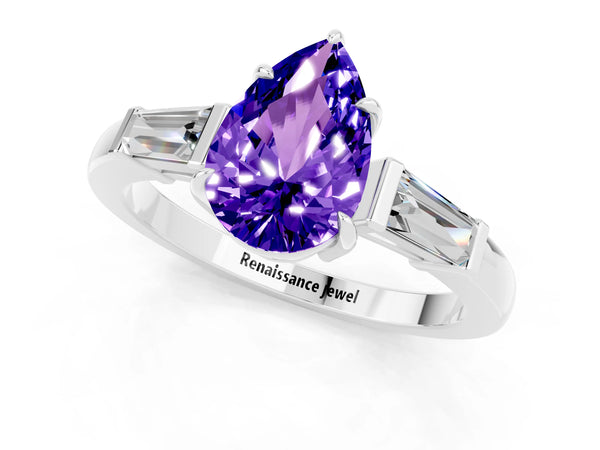 Platinum Pear Cut Tanzanite Three-Stone Ring with Tapered Baguette Side Stones and Prong Setting