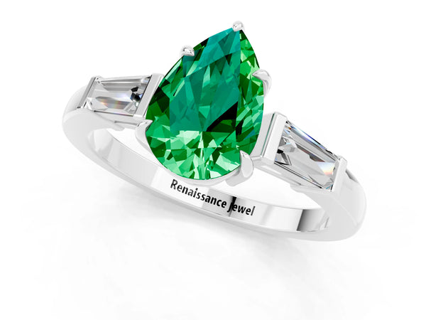 Silver Pear Cut Emerald Three-Stone Ring with Tapered Baguette Side Stones and Prong Setting