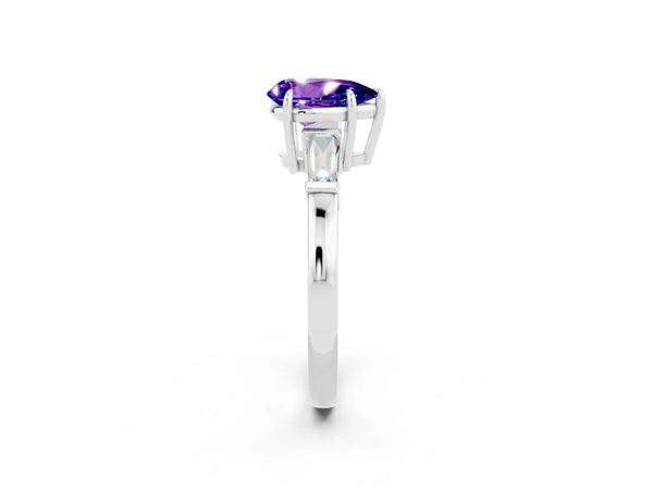 White gold Pear Cut Tanzanite Three-Stone Ring with Tapered Baguette Side Stones and Prong Setting
