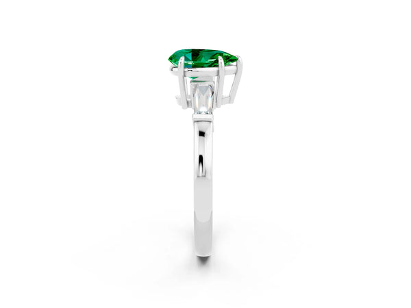 Platinum Pear Cut Emerald Three-Stone Ring with Tapered Baguette Side Stones and Prong Setting