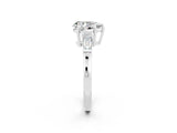 White gold Pear Cut Cut Diamond Ring with Tapered Baguette Side Stones in Four-Prong Setting_2