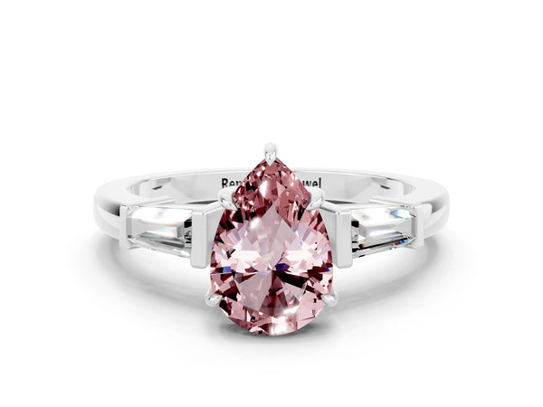 White gold Pear Cut Cut Diamond Ring with Tapered Baguette Side Stones in Four-Prong Setting