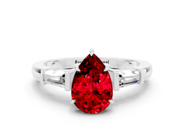 Platinum Pear Cut Cut Diamond Ring with Tapered Baguette Side Stones in Four-Prong Setting