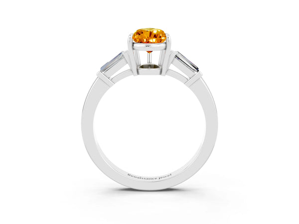 Platinum Pear Cut Citrine Three-Stone Ring with Tapered Baguette Side Stones and Prong Setting