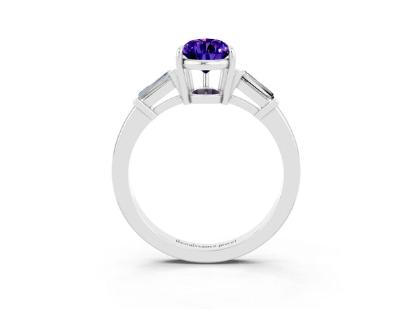 Platinum Pear Cut Tanzanite Three-Stone Ring with Tapered Baguette Side Stones and Prong Setting