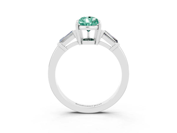 White gold Pear Cut Green Sapphire Three-Stone Ring with Tapered Baguette Side Stones and Prong Setting