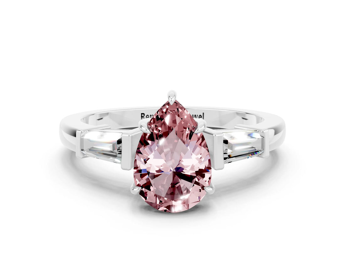 White gold Pear Cut Cut Diamond Ring with Tapered Baguette Side Stones in Four-Prong Setting