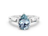 White gold Pear Cut Cut Diamond Ring with Tapered Baguette Side Stones in Four-Prong Setting