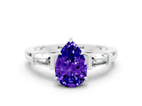 White gold Pear Cut Cut Diamond Ring with Tapered Baguette Side Stones in Four-Prong Setting