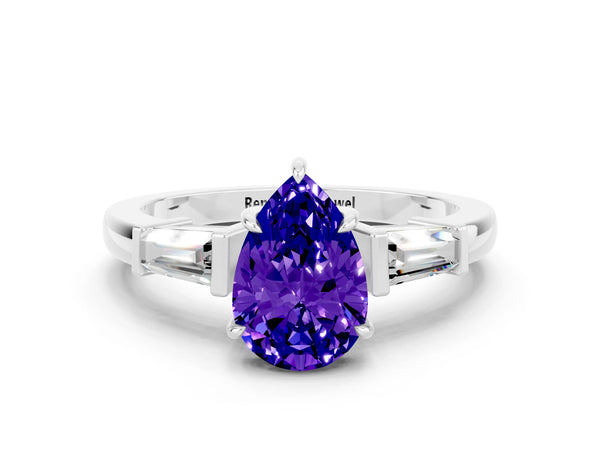 Platinum Pear Cut Tanzanite Three-Stone Ring with Tapered Baguette Side Stones and Prong Setting
