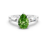 White gold Pear Cut Cut Diamond Ring with Tapered Baguette Side Stones in Four-Prong Setting