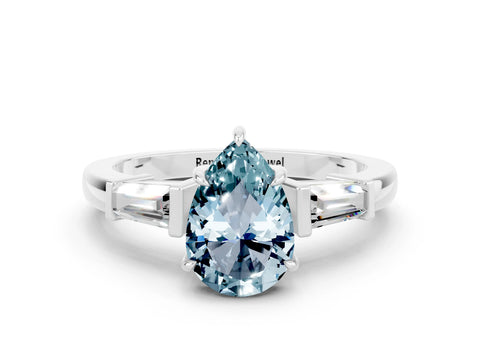 White gold Pear Cut Cut Diamond Ring with Tapered Baguette Side Stones in Four-Prong Setting