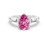 White gold Pear Cut Cut Diamond Ring with Tapered Baguette Side Stones in Four-Prong Setting