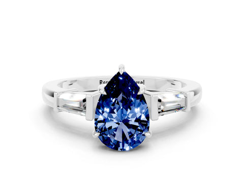 White gold Pear Cut Cut Diamond Ring with Tapered Baguette Side Stones in Four-Prong Setting