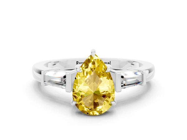 White gold Pear Cut Yellow Sapphire Three-Stone Ring with Tapered Baguette Side Stones and Prong Setting