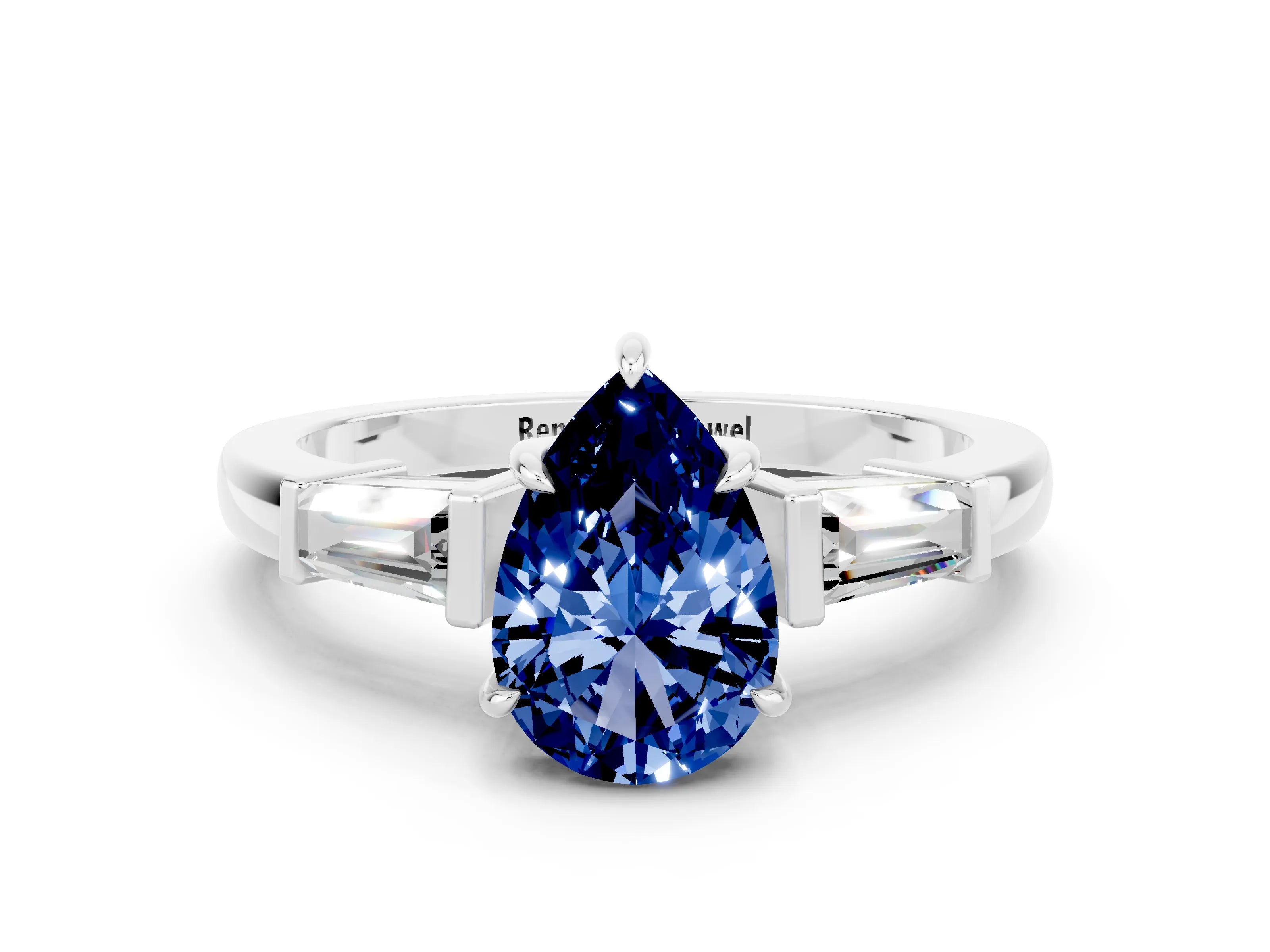 White gold Pear Cut Cut Diamond Ring with Tapered Baguette Side Stones in Four-Prong Setting