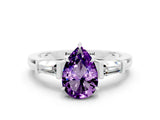 White gold Pear Cut Cut Diamond Ring with Tapered Baguette Side Stones in Four-Prong Setting