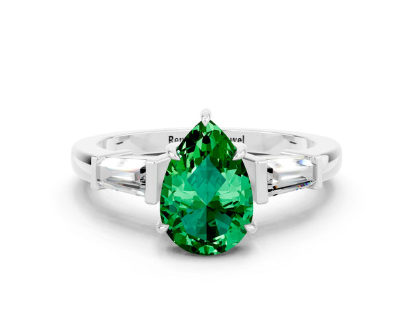 Platinum Pear Cut Emerald Three-Stone Ring with Tapered Baguette Side Stones and Prong Setting