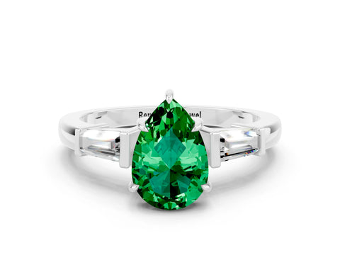 White gold Pear Cut Cut Diamond Ring with Tapered Baguette Side Stones in Four-Prong Setting