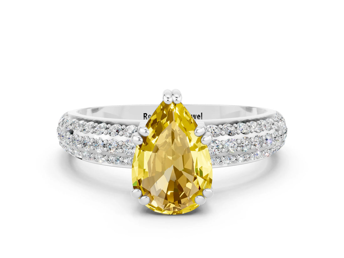 White gold Pear Cut Cut Pave Diamond Engagement Ring with Channel Set Band and Four-Prong Setting