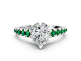 White gold Pear Cut Diamond Cathedral Solitaire Ring with Round with Emerald side stone Pavé Band