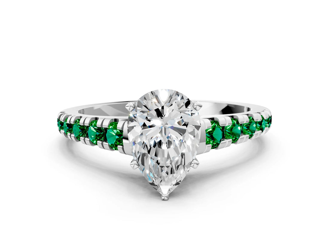 White gold Pear Cut Diamond Cathedral Solitaire Ring with Round with Emerald side stone Pavé Band