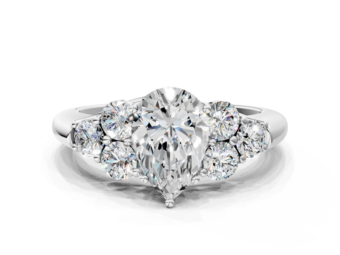 White gold Pear Cut Diamond Cluster Ring with Round Accent Stones and Prong Setting on a Classic Band_79