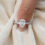 White gold Pear Cut Diamond Engagement Ring with Side Stone Accents and Four-Prong Setting_54