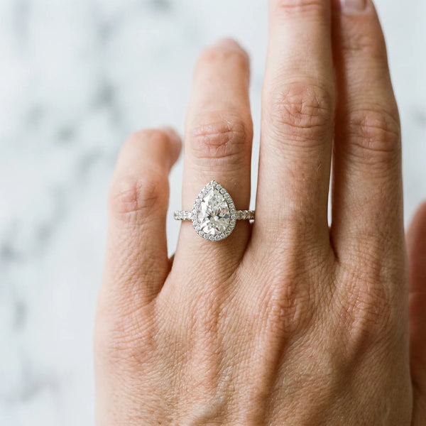 White gold Pear Cut Diamond Halo Engagement Ring with Pavé Band and Prong Setting