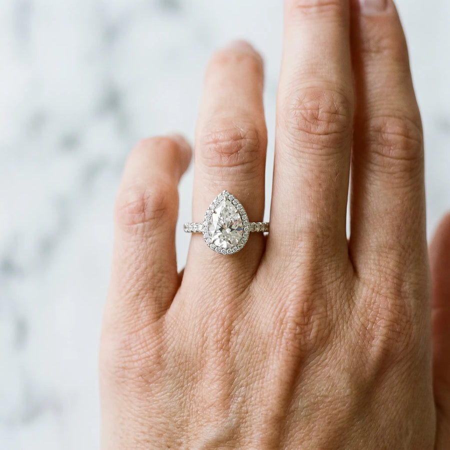 White gold Pear Cut Diamond Halo Engagement Ring with Pavé Band and Prong Setting