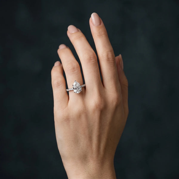 White gold Pear Cut Diamond Pavé Band Ring with Four-Prong Setting