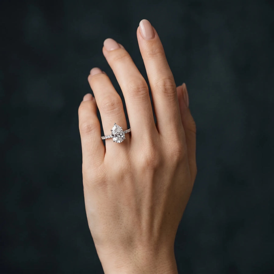 White gold Pear Cut Diamond Pavé Band Ring with Four-Prong Setting