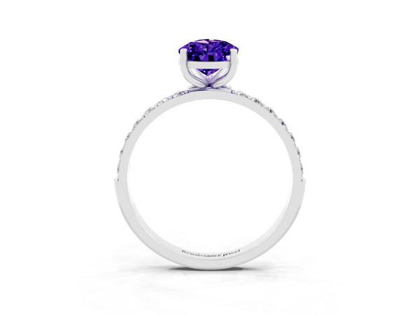 Platinum Pear Cut Tanzanite Solitaire Ring with Round Pavé Shoulders and Prong Setting