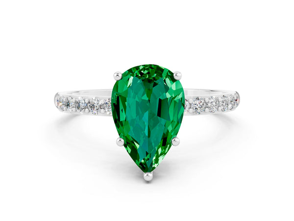White gold Pear Cut Emerald Solitaire Ring with Round Pavé Shoulders and Prong Setting