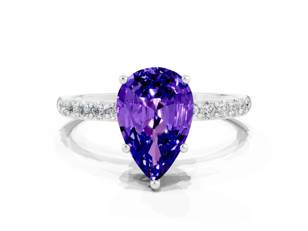 White gold Pear Cut Tanzanite Solitaire Ring with Round Pavé Shoulders and Prong Setting
