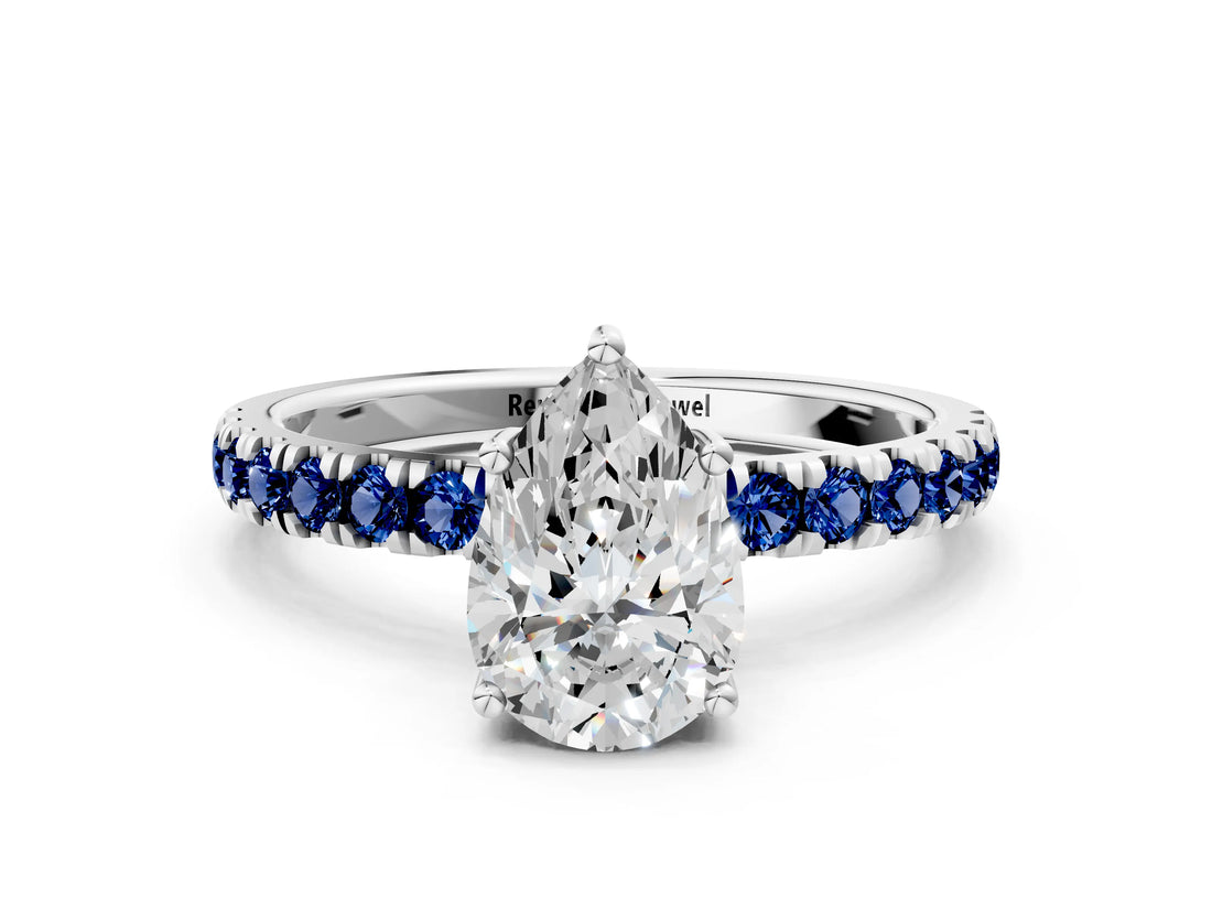 White gold Pear Cut Diamond Pave Band Solitaire Ring with Round with Blue Sapphire side stone and Prong Setting_24