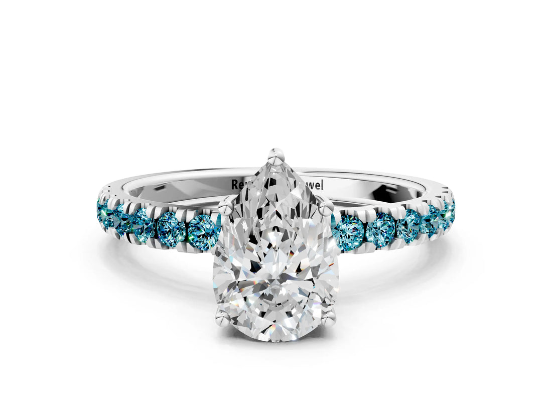 White gold Pear Cut Diamond Pave Band Solitaire Ring with Round with Blue Topaz side stone and Prong Setting