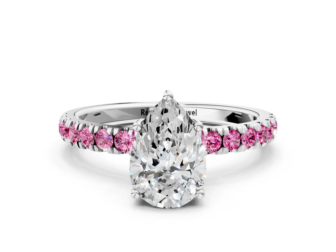 White gold Pear Cut Diamond Pave Band Solitaire Ring with Round with Pink Sapphire side stone and Prong Setting