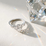 White gold Pear Cut Diamond Ring with Baguette Side Stones, Channel Set Band, and Four-Prong Setting_16