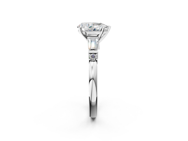 White gold Pear Cut Diamond Ring with Baguette Side Stones, Channel Set Band, and Four-Prong Setting