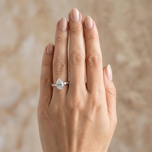 10K White Gold 2.02 Carat F VS1 Pear Diamond Ring with Marquise and Round Side Stones and Four-Prong Setting