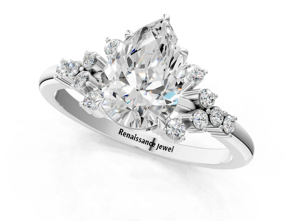 Platinum Pear Cut Diamond Ring with Side Stones and Four-Prong Setting