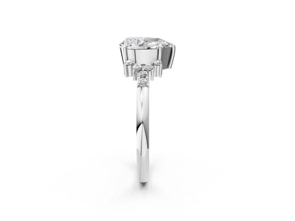 Platinum Pear Cut Diamond Ring with Side Stones and Four-Prong Setting