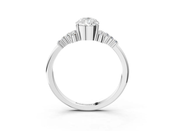 Platinum Pear Cut Diamond Ring with Side Stones and Four-Prong Setting