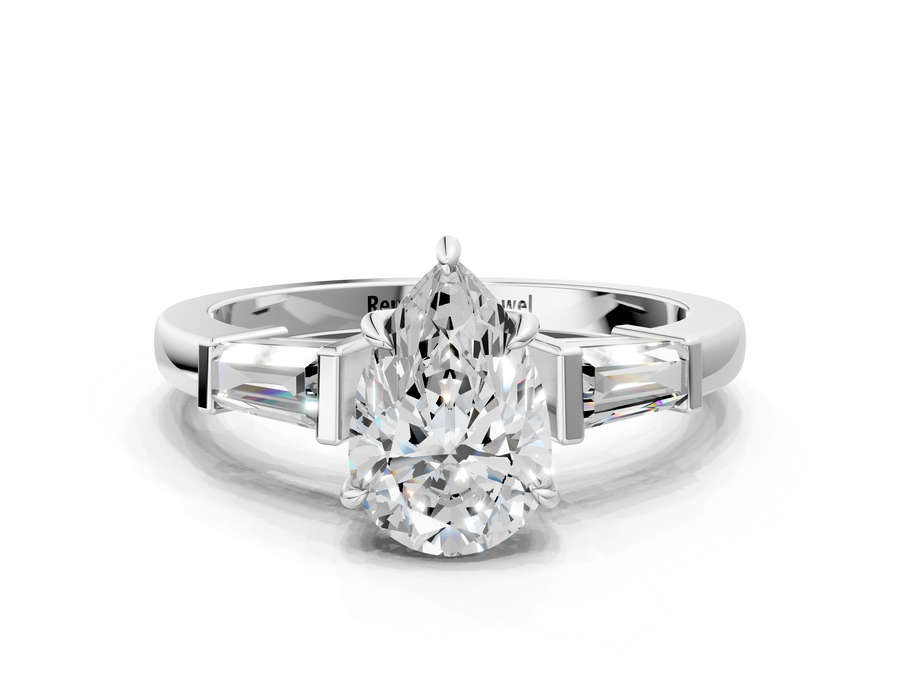 White gold Pear Cut Diamond Ring with Tapered Baguette Side Stones in Four-Prong Setting